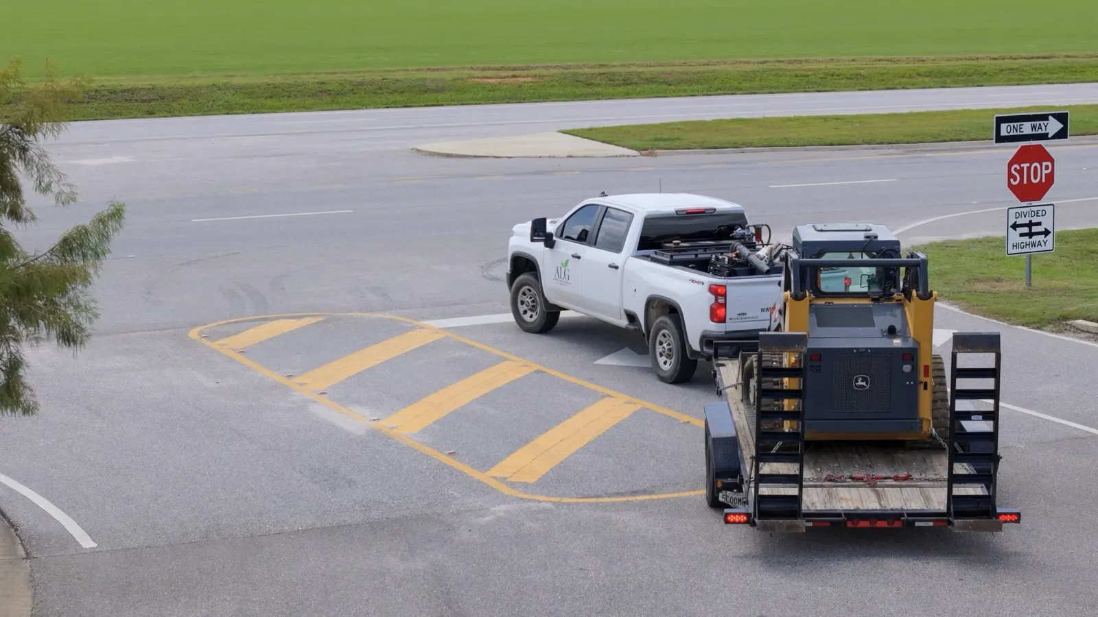 Andrews Lawn & Garden truck and trailered track loader on the road in Loxley, Alabama