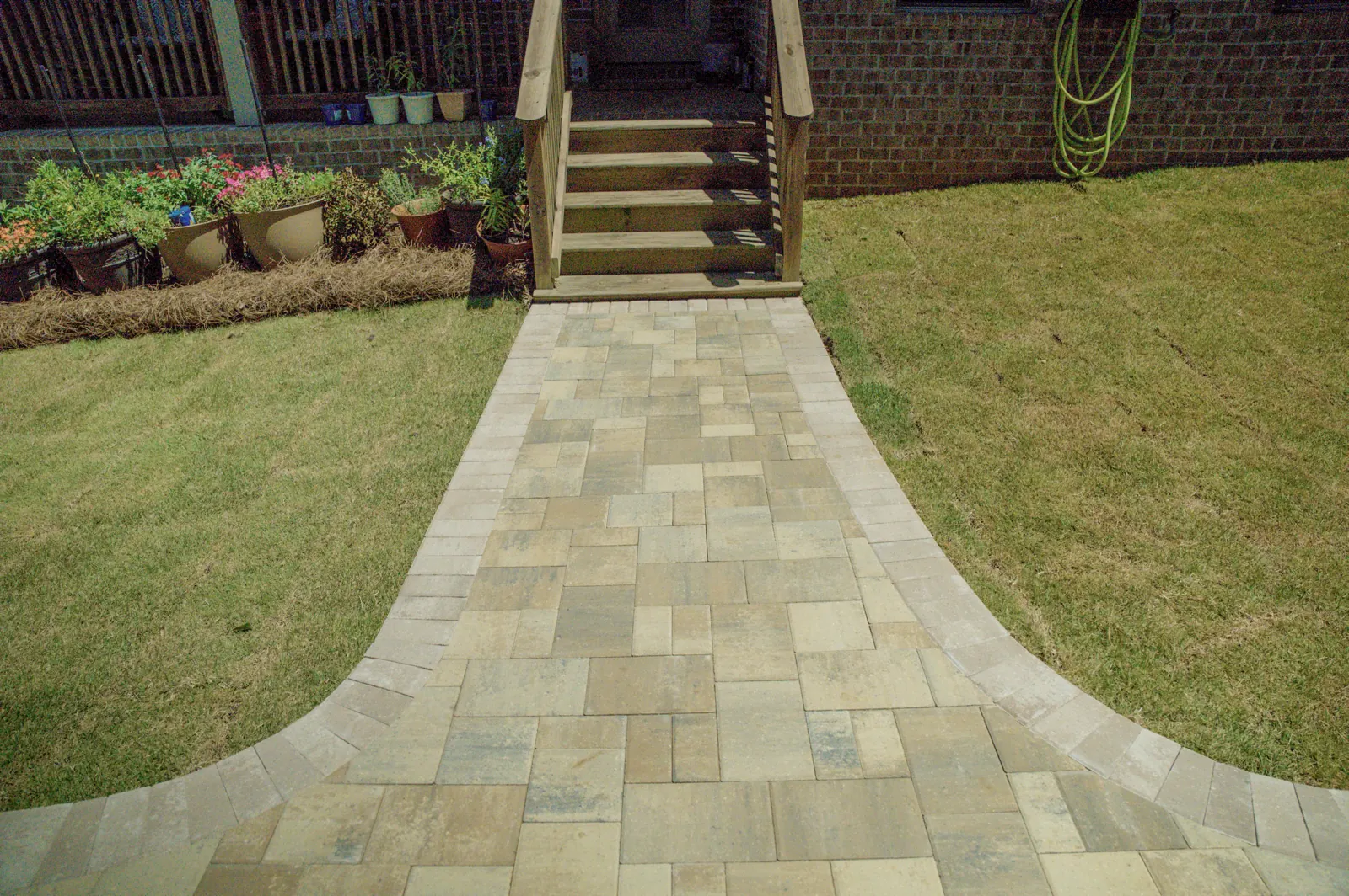 Paver walkway leading through a backyard in Baldwin County, Alabama