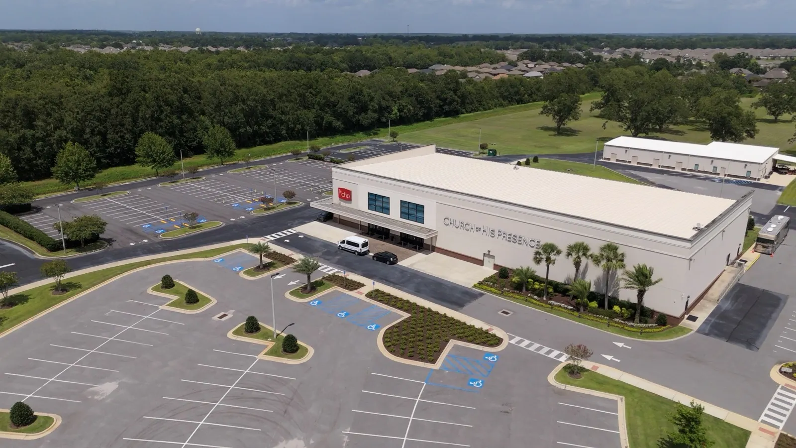Aerial view of the campus building and mowed surrounding grounds in Loxley, Alabama