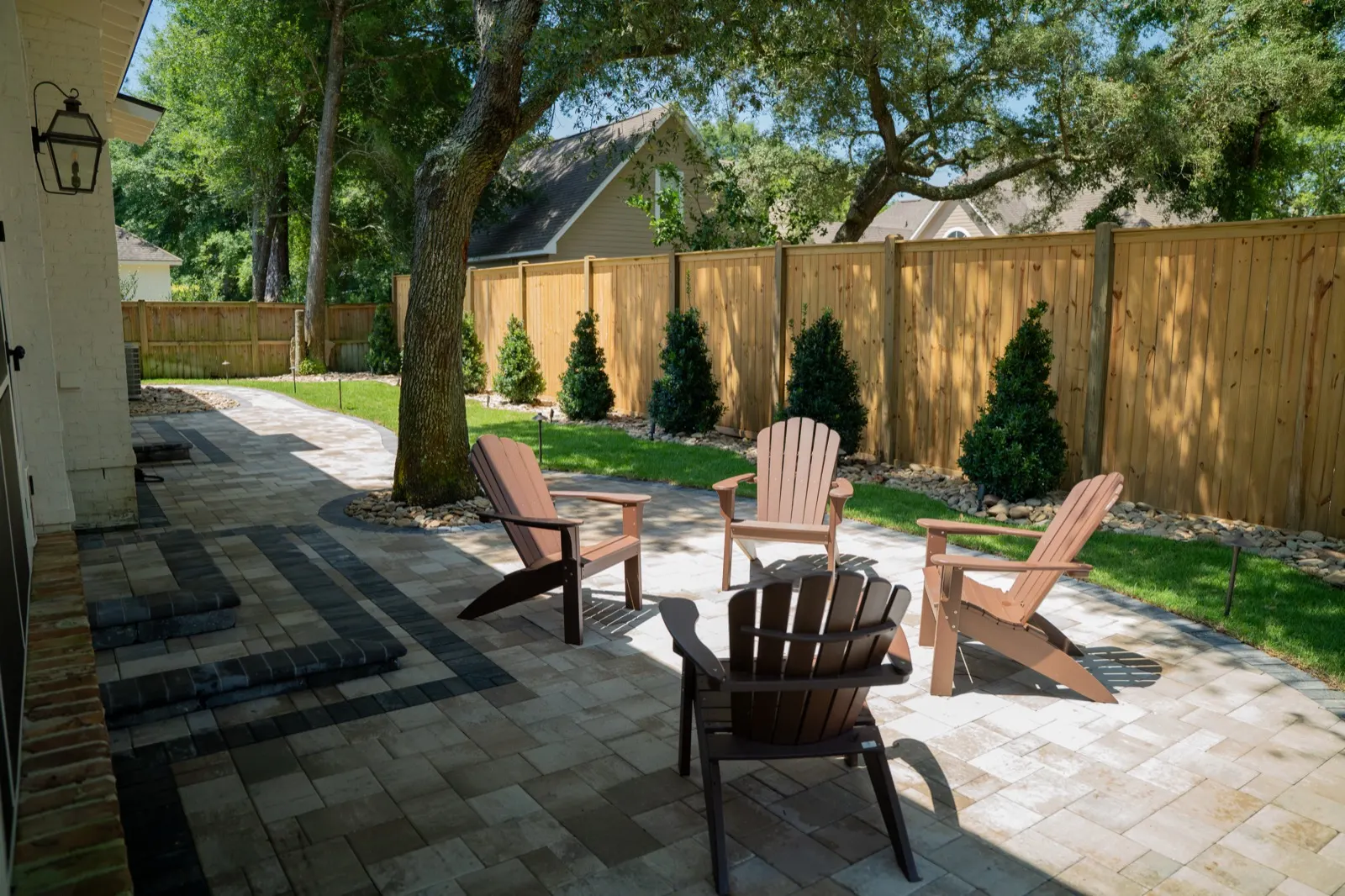 Wide view of a finished paver patio in a backyard in Point Clear, Alabama